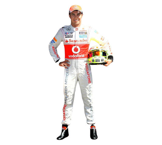 Person in a racing suit holding a helmet on a white background