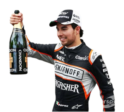 Person in racing suit holding a bottle of champagne with various sponsor logos.