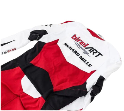 Close-up of a racing suit with Birel Art and Richard Mille branding on a white background