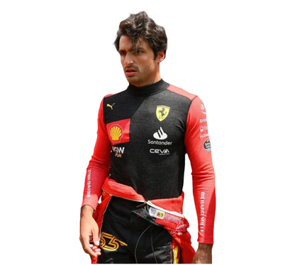 Person wearing a black and red racing suit with various sponsor logos on a white background