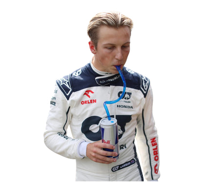 Person in racing suit drinking from a can with a straw on a white background