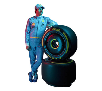 Person in a blue racing suit with Pirelli tires on a white background