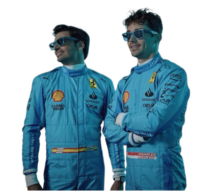Two men in blue racing suits with various logos on a white background