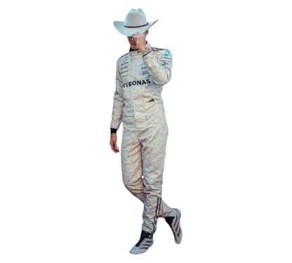 Person wearing a racing suit with 'Petronas' branding on a white background