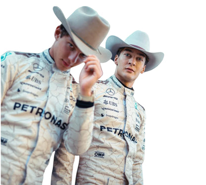Two individuals wearing racing suits with 'Petronas' branding and cowboy hats.