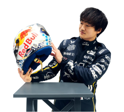 Person holding a colorful helmet with visible branding