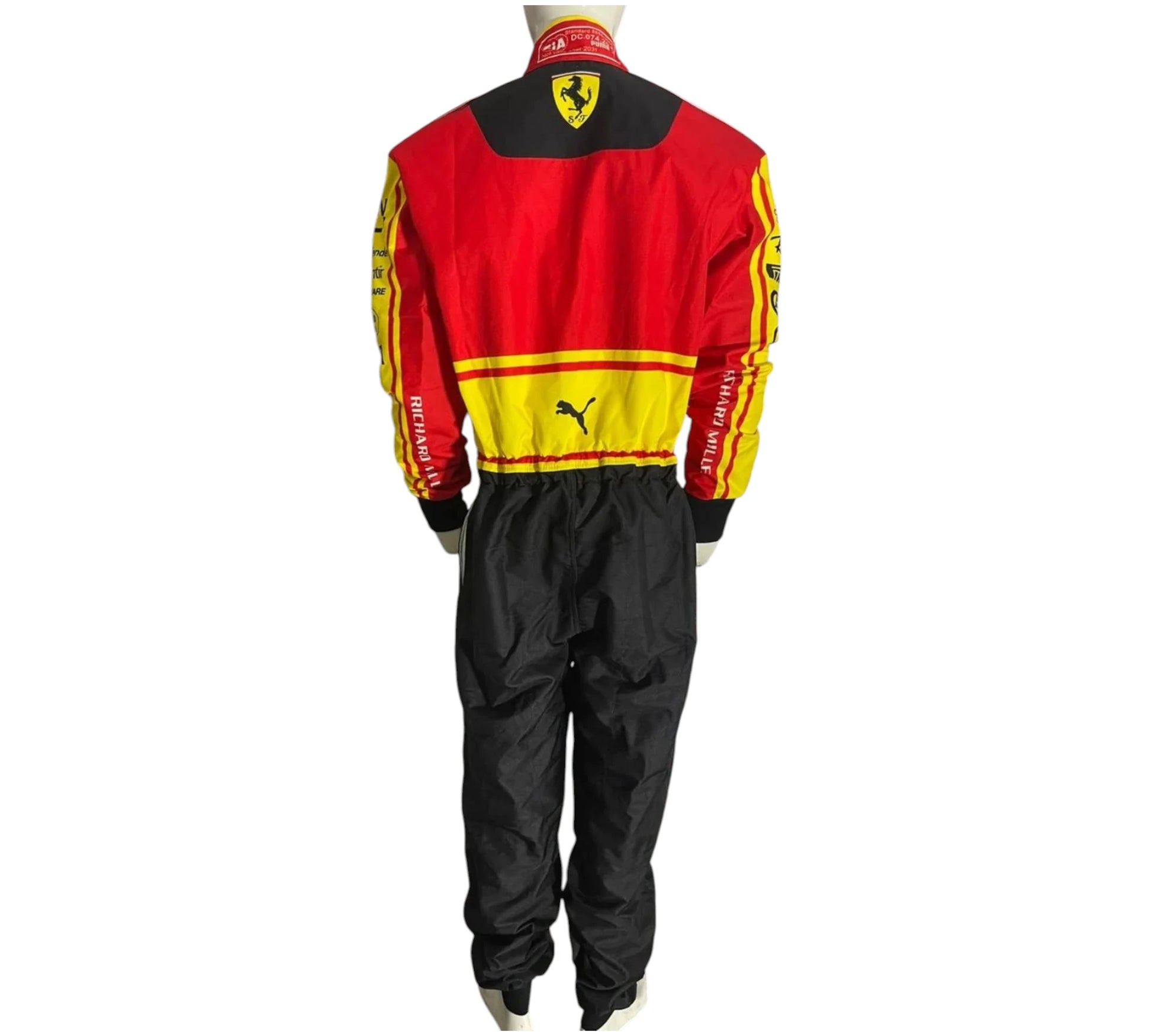 Person wearing a red racing suit with various sponsor logos on a white background