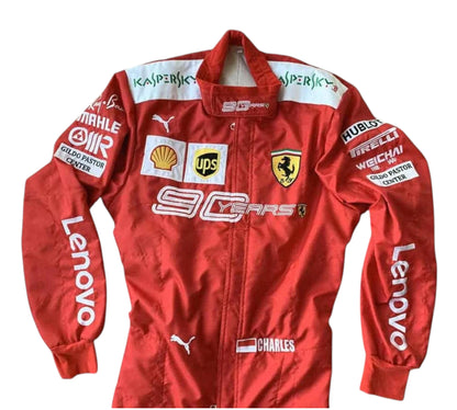 Red racing suit with various sponsor logos on a white background