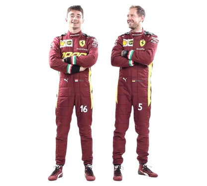 Two individuals wearing red racing suits with visible branding on a white background