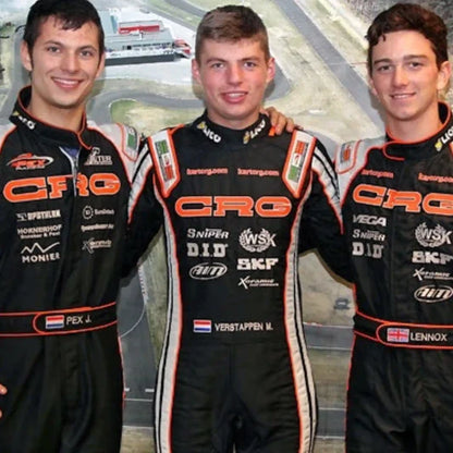 Three racers in CRG racing suits standing together with a race track in the background.
