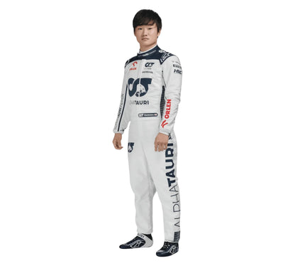 Person wearing a white racing suit with various sponsor logos on a white background