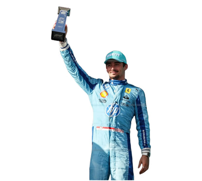 Person in a blue racing suit holding a trophy against a white background