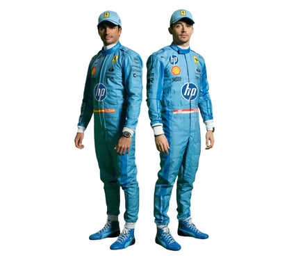 Two individuals wearing matching blue racing suits with various logos on a white background