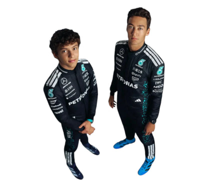 Two children wearing matching black racing suits with sponsor logos on a white background
