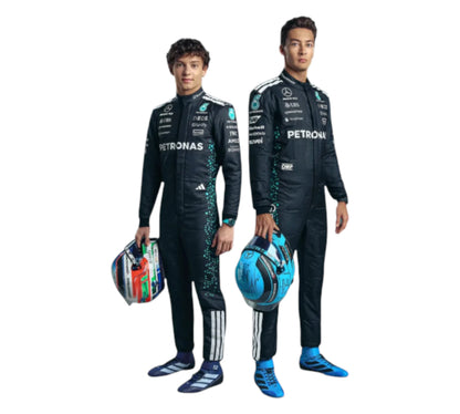 Two individuals in racing suits holding helmets on a white background