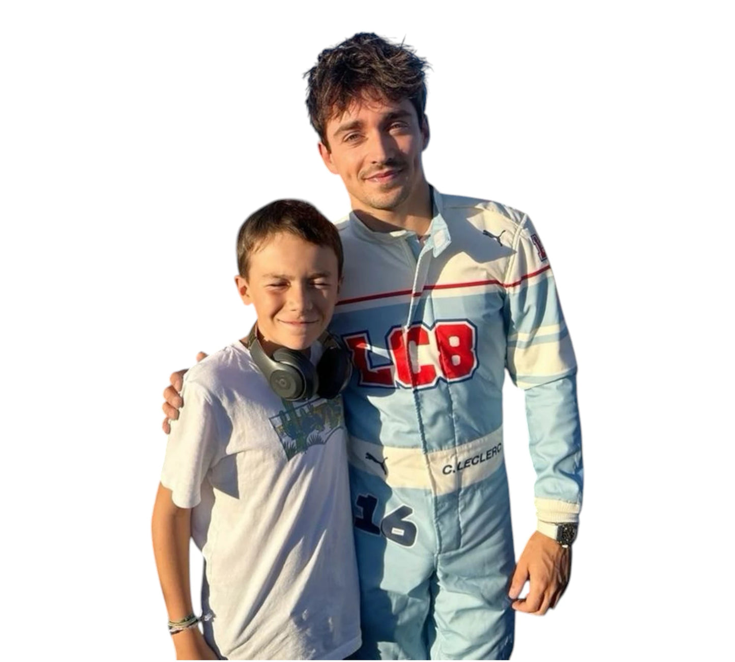 Two people standing together with one wearing a racing suit with 'LCB' branding.